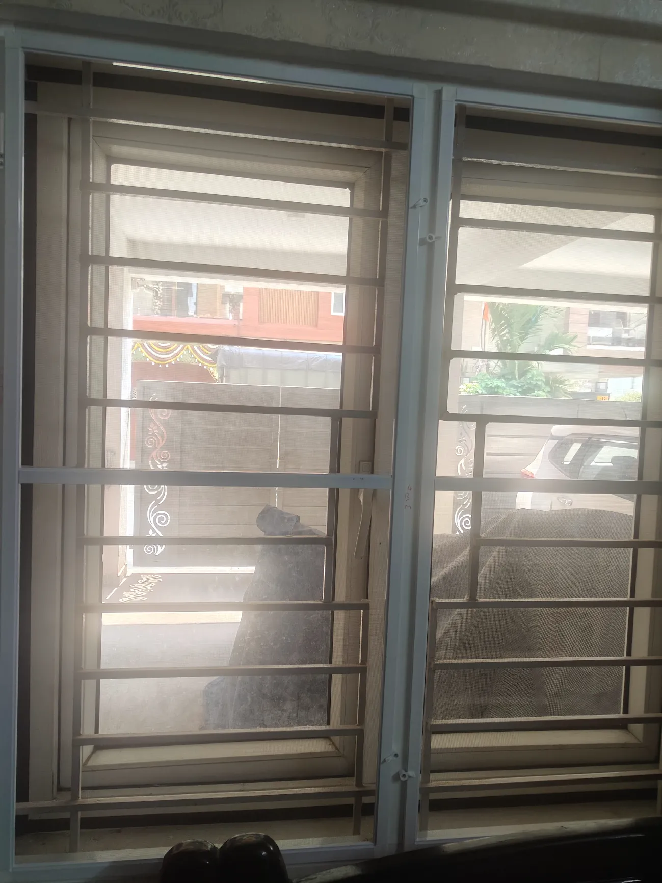 Family enjoying a modern balcony protected with Lucky Mosquito Net